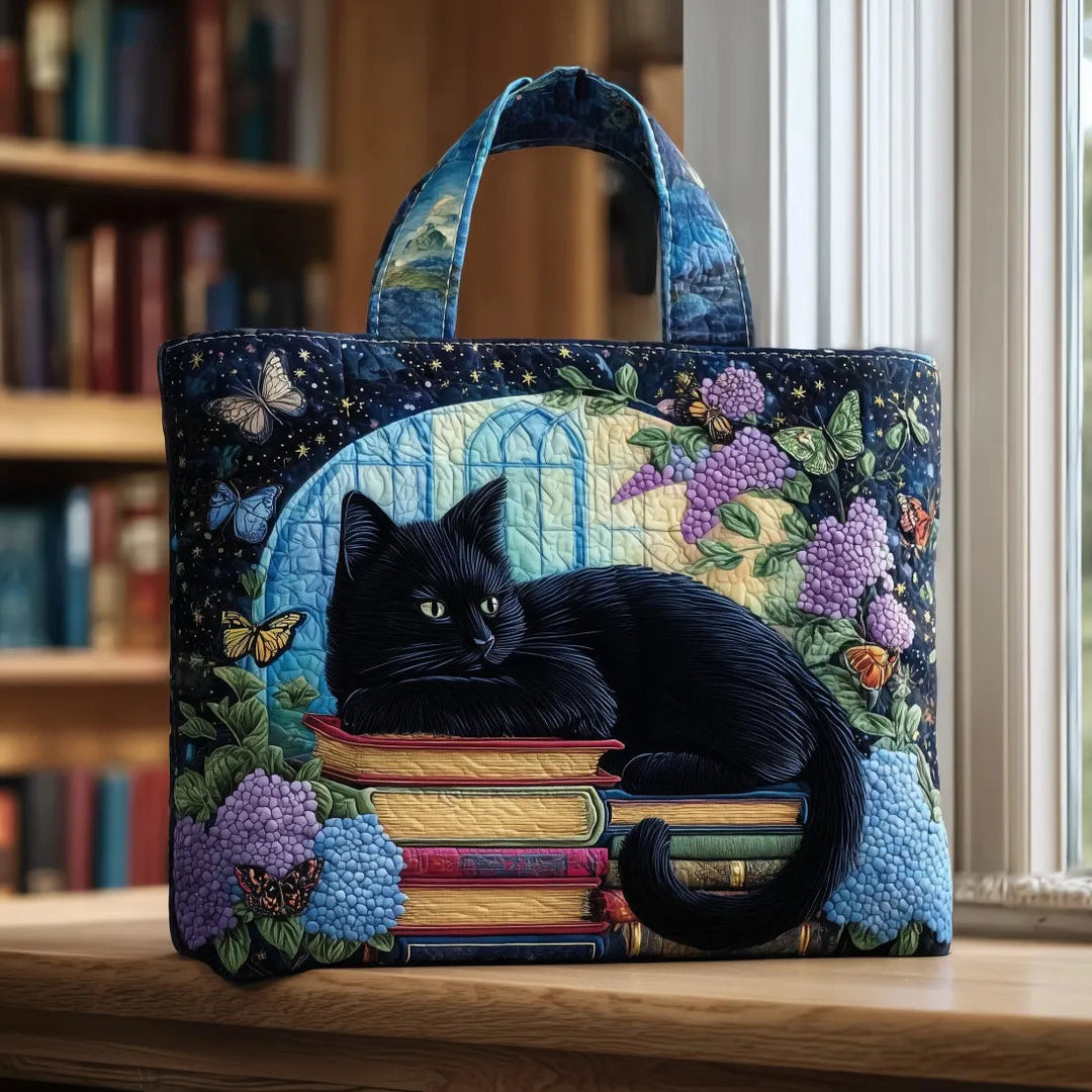 Schwarze Katze auf Büchern – Gesteppte Tasche